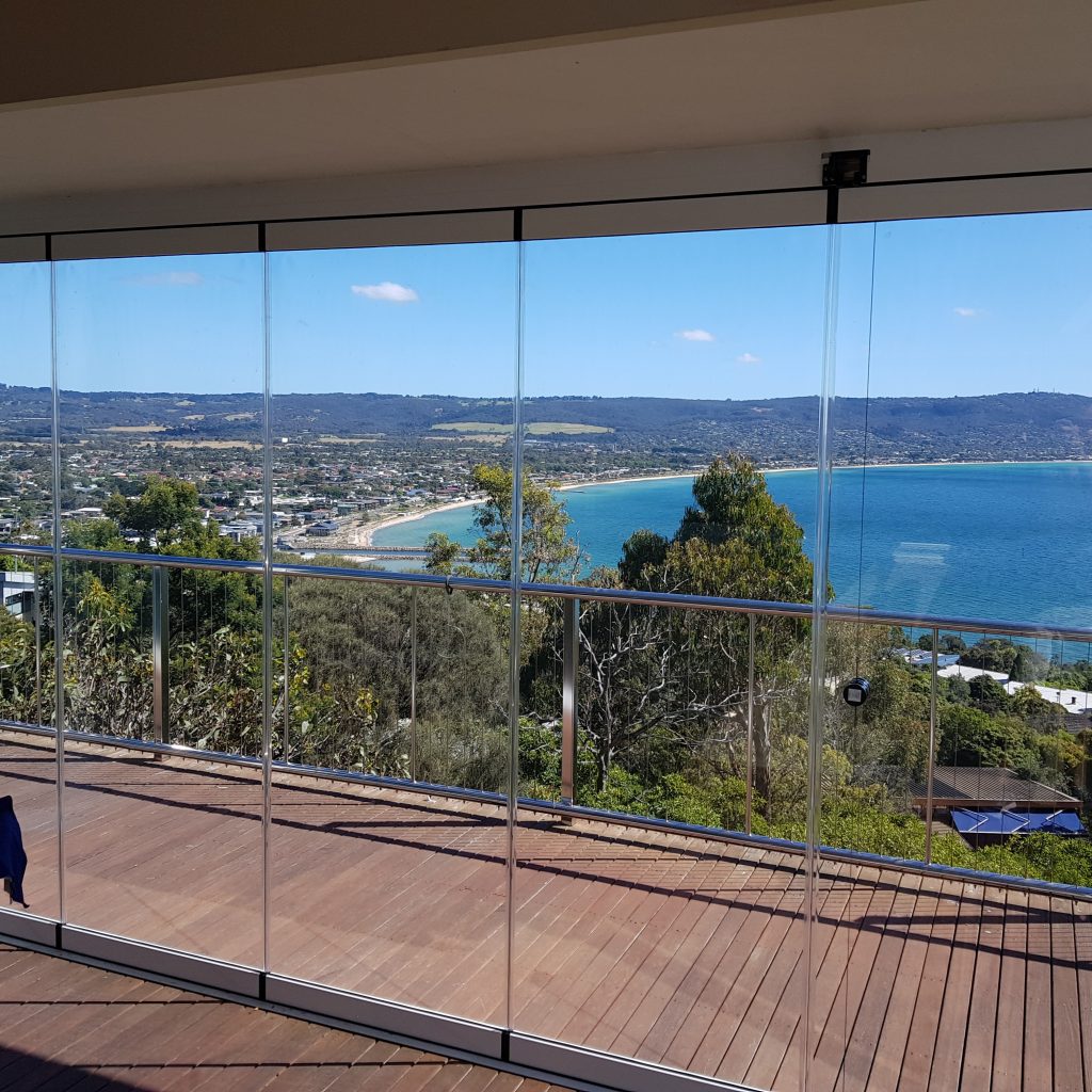 Frameless glass enclosure looking out to sea view