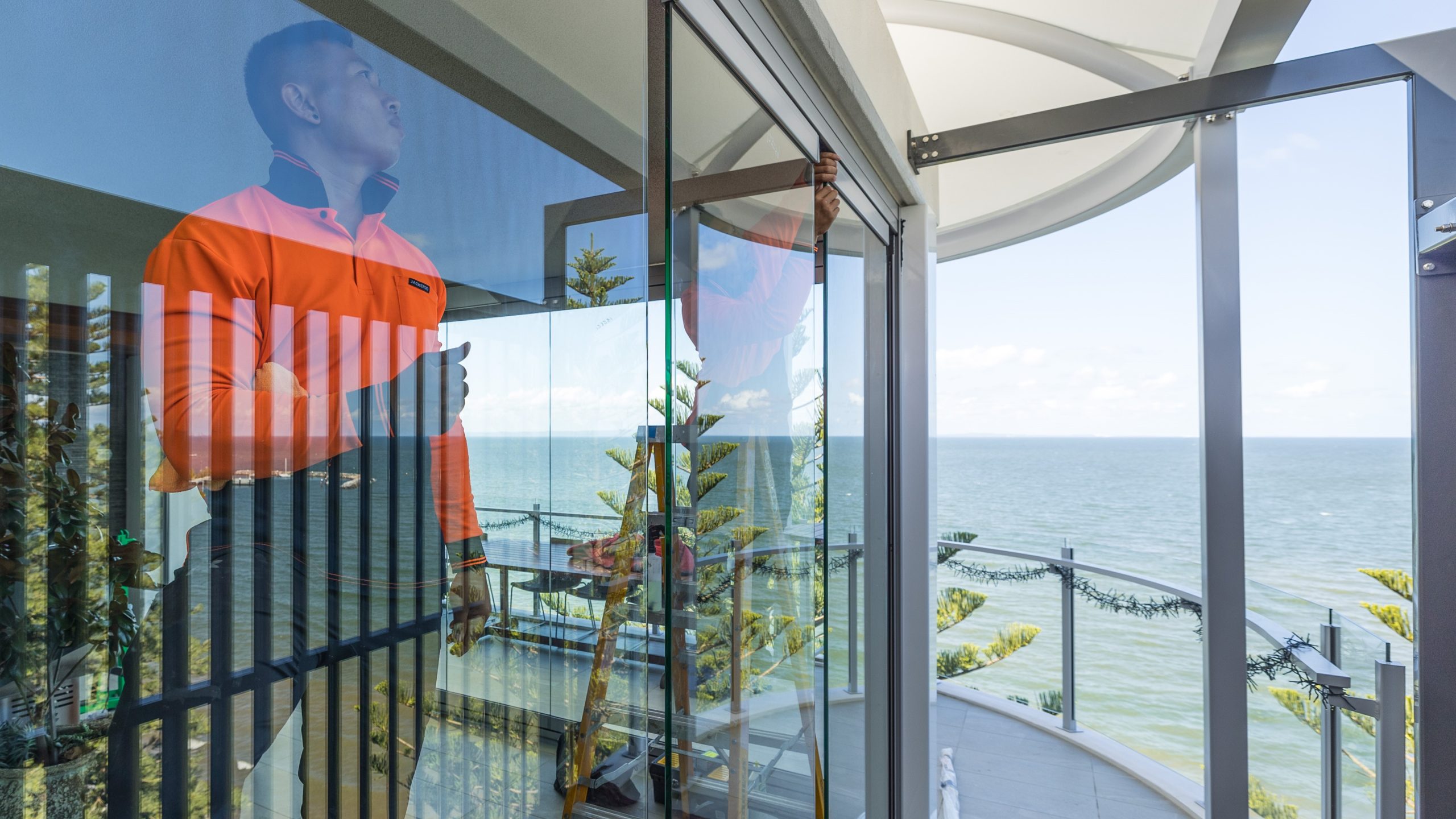 man installing glass door