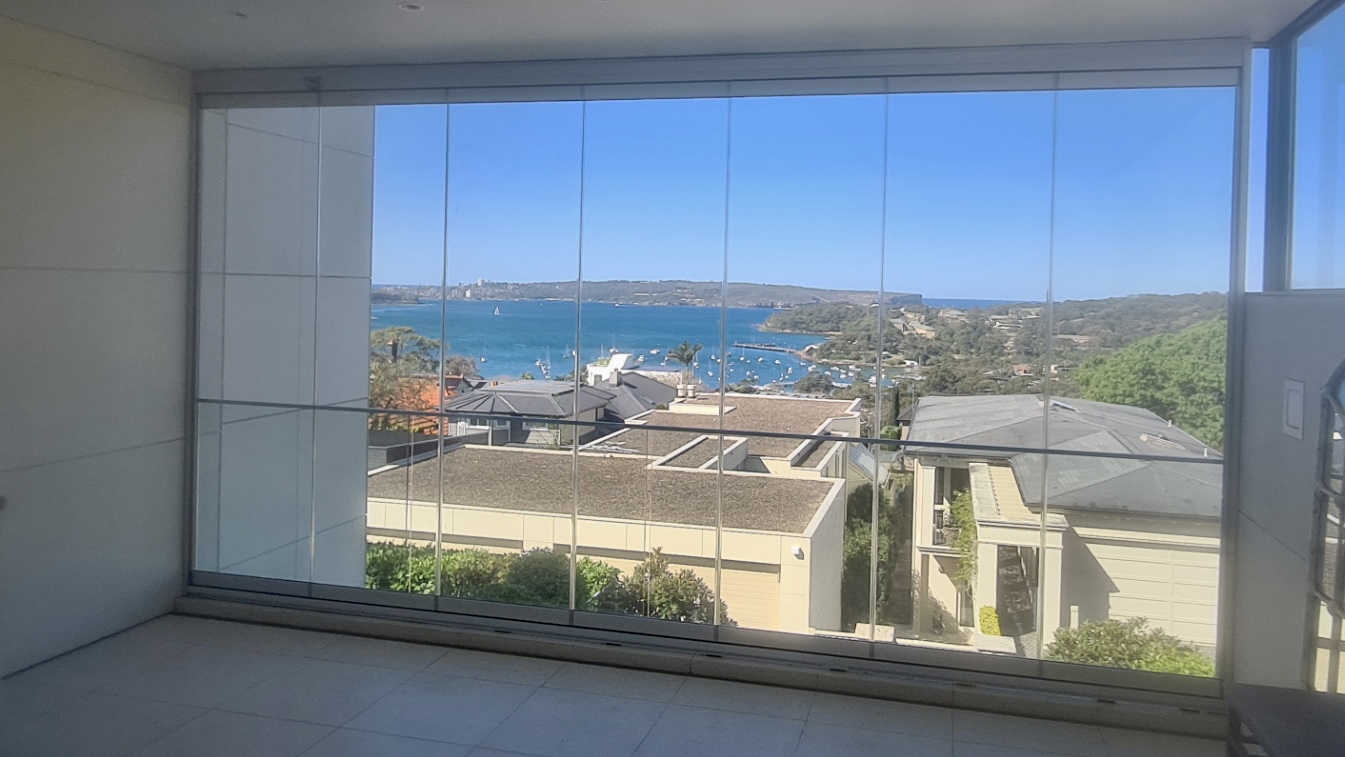 Balcony enclosed with frameless glass